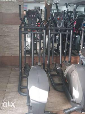 Two Gray-and-black Elliptical Trainers