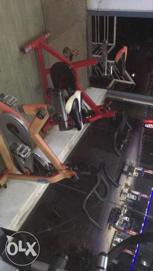 Two Red And Orange Stationary Bicycles