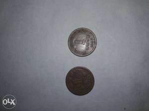 Two Round Copper And Silver Coins