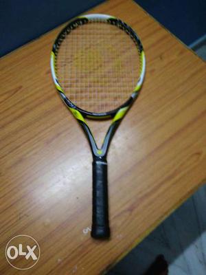 White, Yellow And Black Tennis Racket