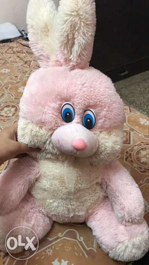 A pink n beige rabbit plush toy by archies