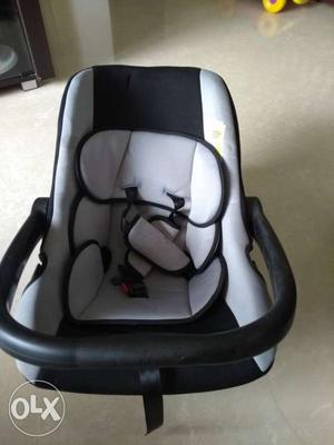 Baby's White And Black Car Carrier Seat