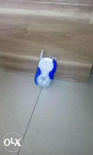 Baby's White And Blue Monitoring Device