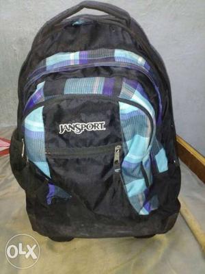 Black, Blue, And Purple Jansports Backpack