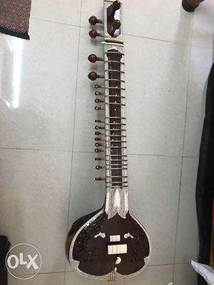 Brown And White String Instrument