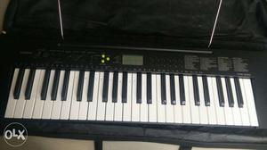 Casio keyboard with detachable book holder -