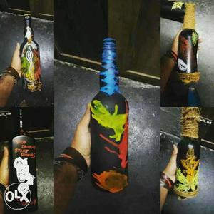 Five Black, Green, Blue, White And Red Decorative Bottles