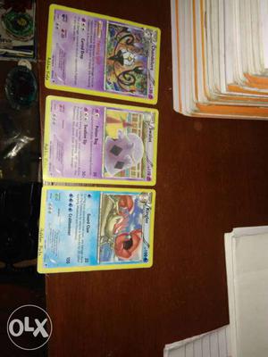Three Pokemon Trading Cards