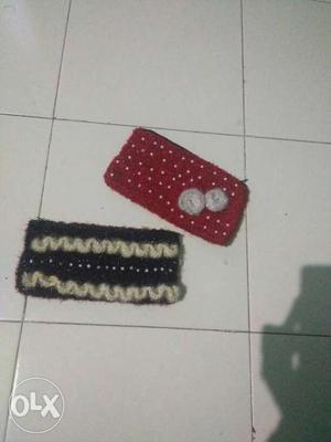 Two Red And Black Knit Wallets