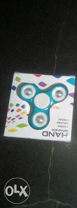 White And Teal Fidget Spinner In Box