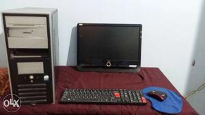 Black Flat Screen Computer Monitor With Mouse, Keyboard, And