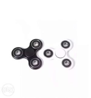 Two White And Black 3-bladed Fidget Spinners