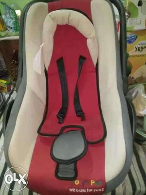 Baby's Red And White Car Seat Carrier