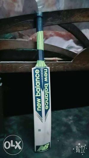 Beige And Green New Balance Cricket Paddle