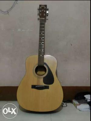 Beige Dreadnought Acoustic Guitar With Black Scratch Plate