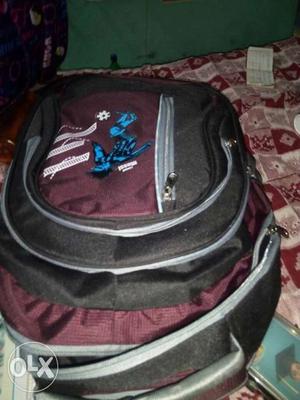Black, Grey, And Maroon Backpack