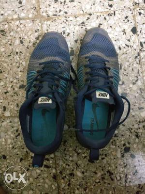 Blue Nike Air Max training shoes