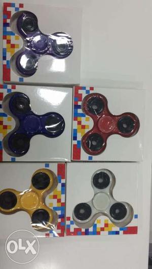 Five Purple,blue,red,yellow And White Hand Spinners
