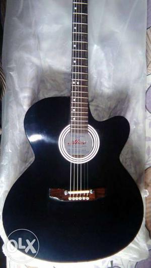 One(1) new semi jumbo cutaway Acoustic Guitar with bag in