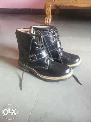 Pair Of Black Leather Boots