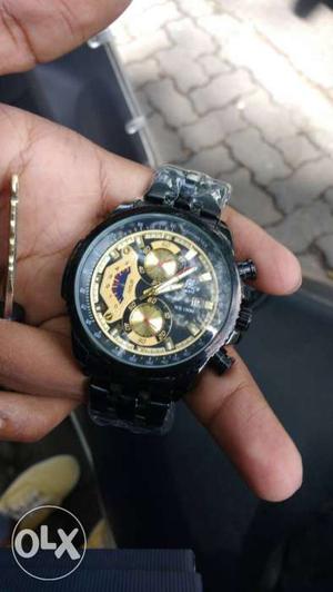 Round Black And Gold Mechanical Watch