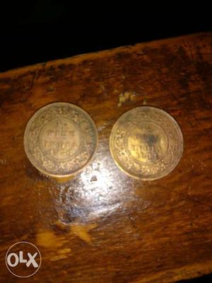 Two Round Gold-colored Coins 83 years old coin