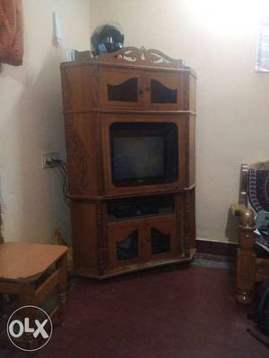 Black CRT TV And Brown Wooden TV Hutch