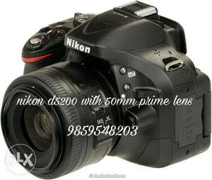 Black Nikon D With 50mm Prime Lens