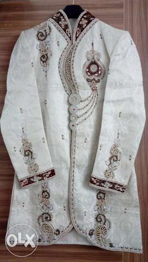 Cream color patterned with diamond work.