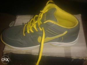 Gray And Yellow High Top Shoe On Box