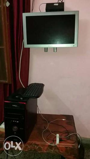 Gray Flat Screen Monitor, Computer Tower, And Keyboard