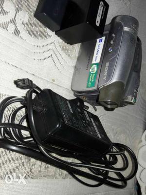 Grey Sony Handycam And Charger