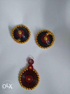 Pair Of Black And Gold Jhumkas And Pendant