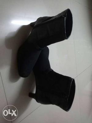 Pair Of Black Leather Heeled Booties