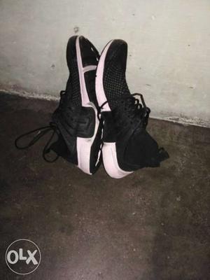 Pair Of Black Low Top Shoes