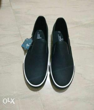 Pair Of Black Polo Slip-on Shoes