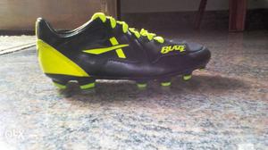 Pair Of Black-and-yellow Reebok Cleat Shoes