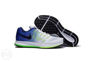 Pair Of White-blue-and-green Nike Sneakers