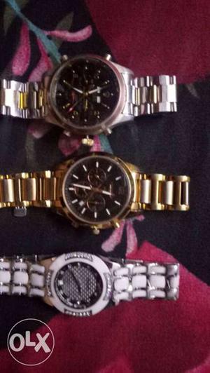 Three Silver And Gold Watches With Bracelets