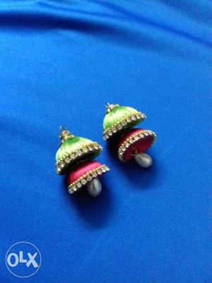 Two Pairs Of Green And Pink Jhumka Earrings