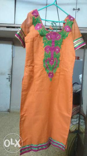 An oomph factor orange kurti with green n rani