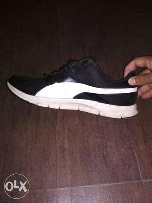Black-and-white Puma Low Top Sneakers 4 month old. size 11