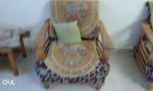 Brown Wooden Armchairs With Brown And Gray Pattern Cushion