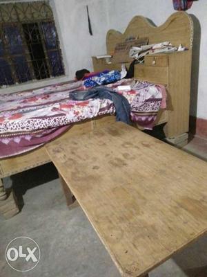 Brown Wooden Bed Frame And Table