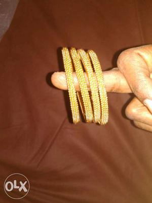 Gold colour man made bangals