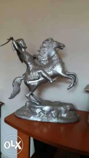 Gray Metal Ceramic Figurine Of Man Holding A Machete Riding