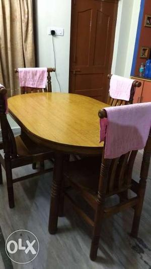 Oval Brown Wooden Table With Four Chairs Dining Set