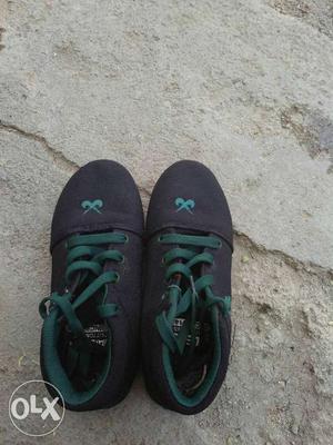 Pair Of Black And Green Plimsolls