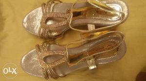 Pair Of Gold Open Toe Heeled Sandals