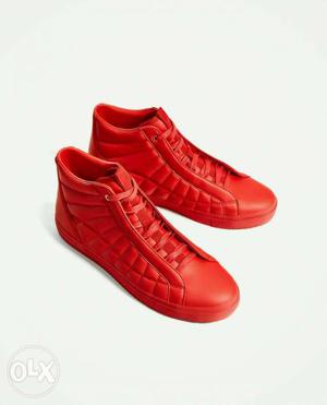 Pair Of Red Leather High Top Sneakers